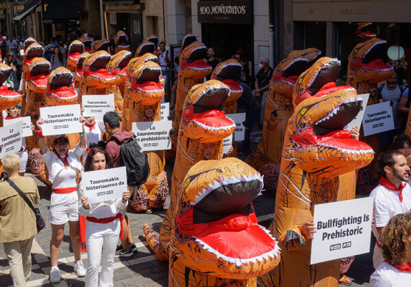 ‘Dinosaurs’ Take Over Pamplona to Protest Torture of Bulls During San Fermín