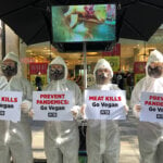 PETA protesters in hazmat suits.