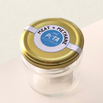 A jar with a sticker that reads
