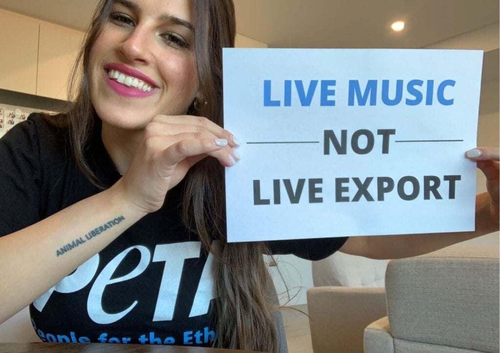 PETA staff with a sign which reads Live Music Not Live Exports