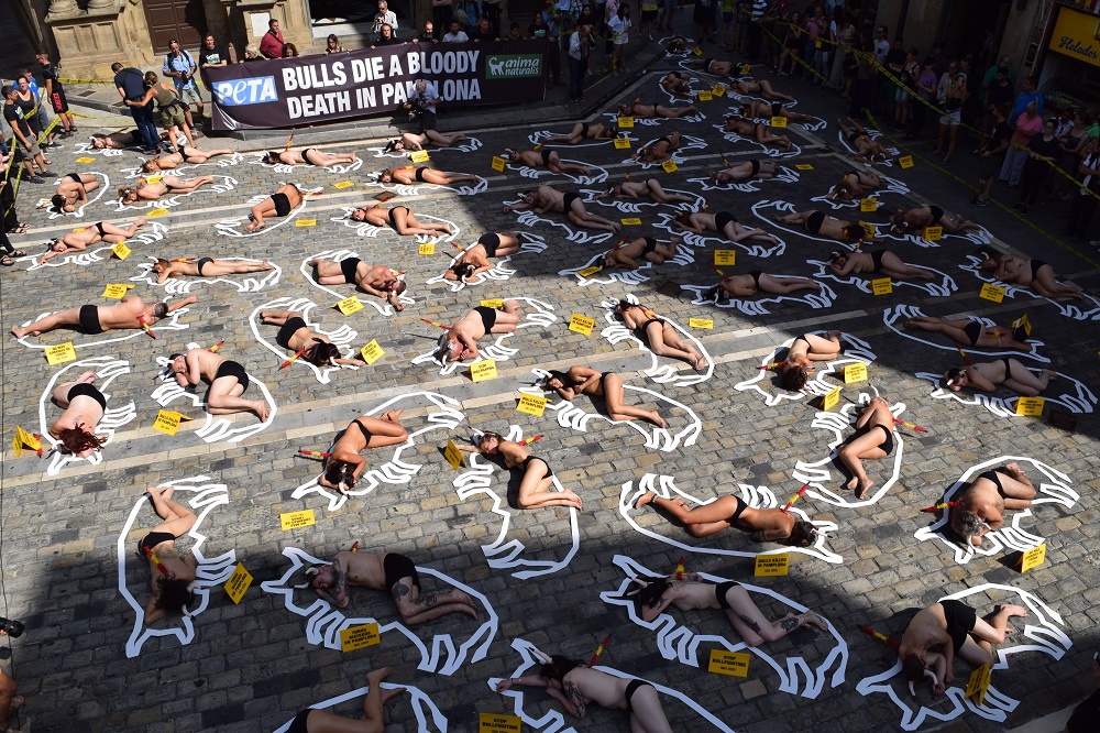 Fifty-four protesters staged a “crime scene” cordoned off with yellow tape in Pamplona, Spain.