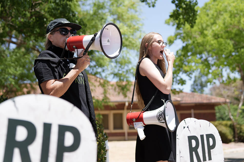 Perth Cup protesters with a megaphone