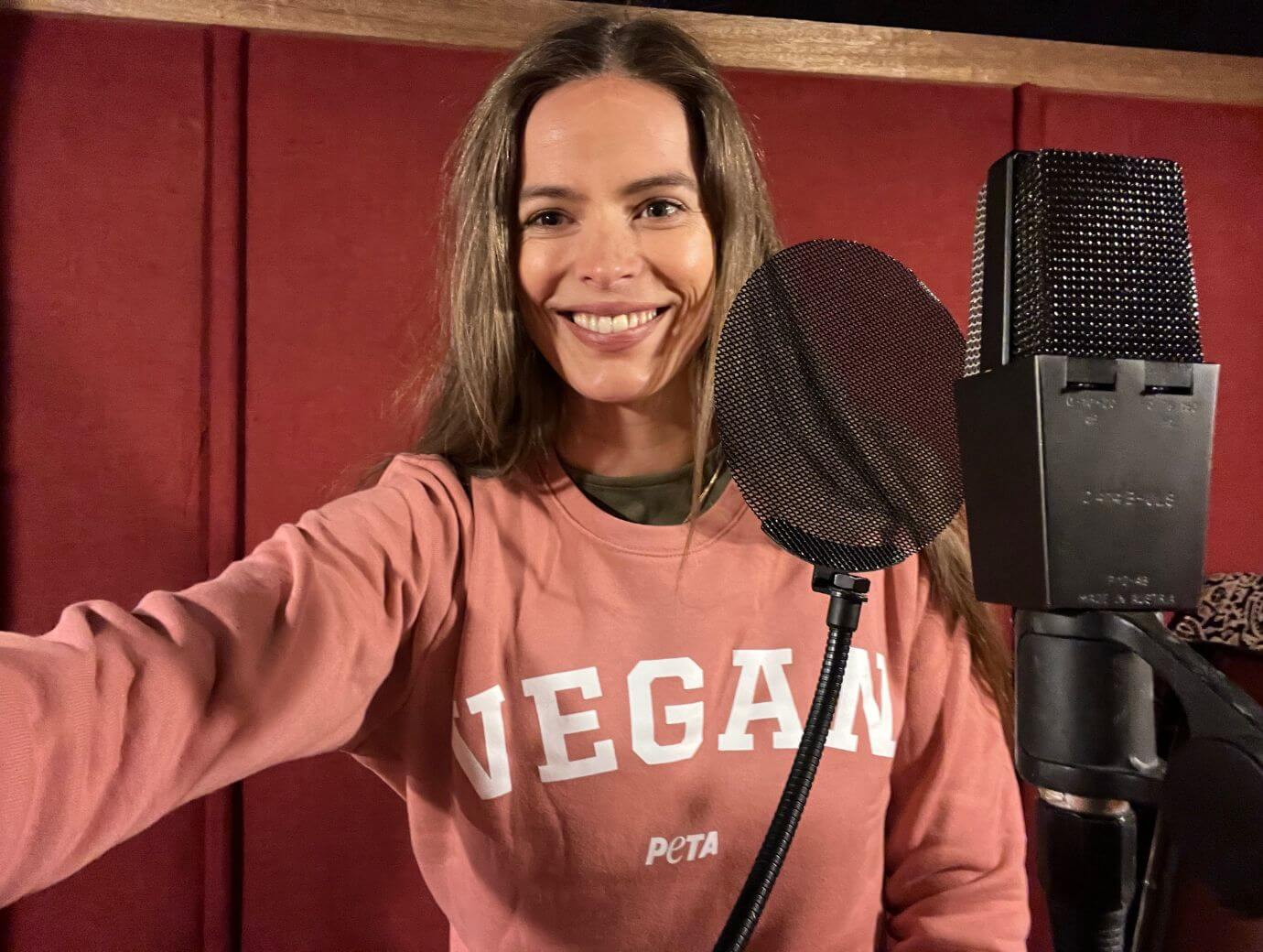 Robyn Lawley in the recording booth for PETA. 