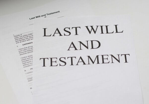 Paper reads "Last Will and Testament"